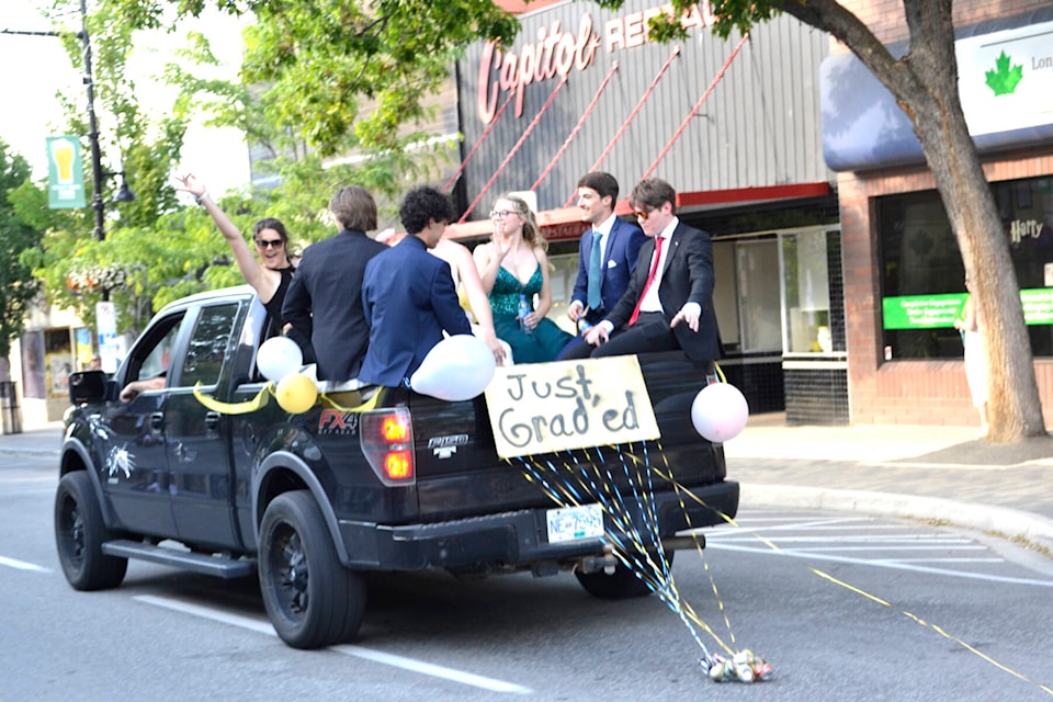 Pen Hi grad parade The 2022 graduating class of Penticton Secondary paraded down Main Street in style Monday night. In gowns and suits, graduates caught a ride on classic cars, boats, Jeeps and trucks. (Monique Tamminga - Western News)