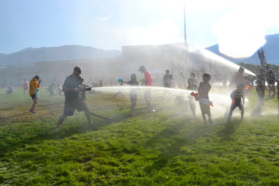 Penticton Fire Department put on the ultimate water fight on the fields of Penticton Secondary Thursday night. (Monique Tamminga Western News)