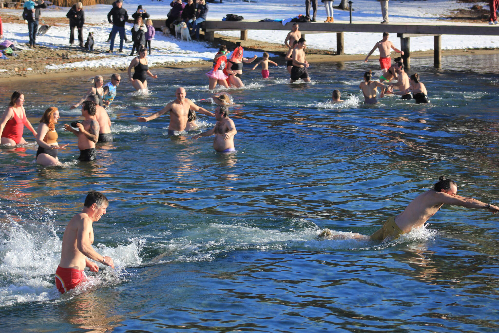 Over $1,000 raised at the 1st annual Naramata polar bear dip Jan. 1. (Chris Heisler photo)
