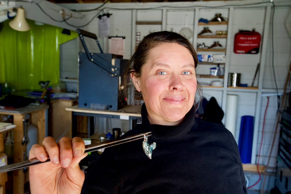 In her backyard studio in Langford, Kimberly Anne Reid sculpts glass into unique jewelry artfully incorporating cremated remains to help people keep the memories of their loved ones close. (Justin Samanski-Langille/News Staff)