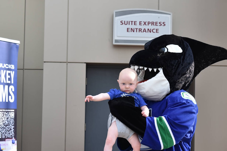 A baby looks pretty chill with Fin’s teeth nearby. Fun being had at the Party on the Plaza at the SOEC in Penticton on Sunday. (Monique Tamminga Western News)