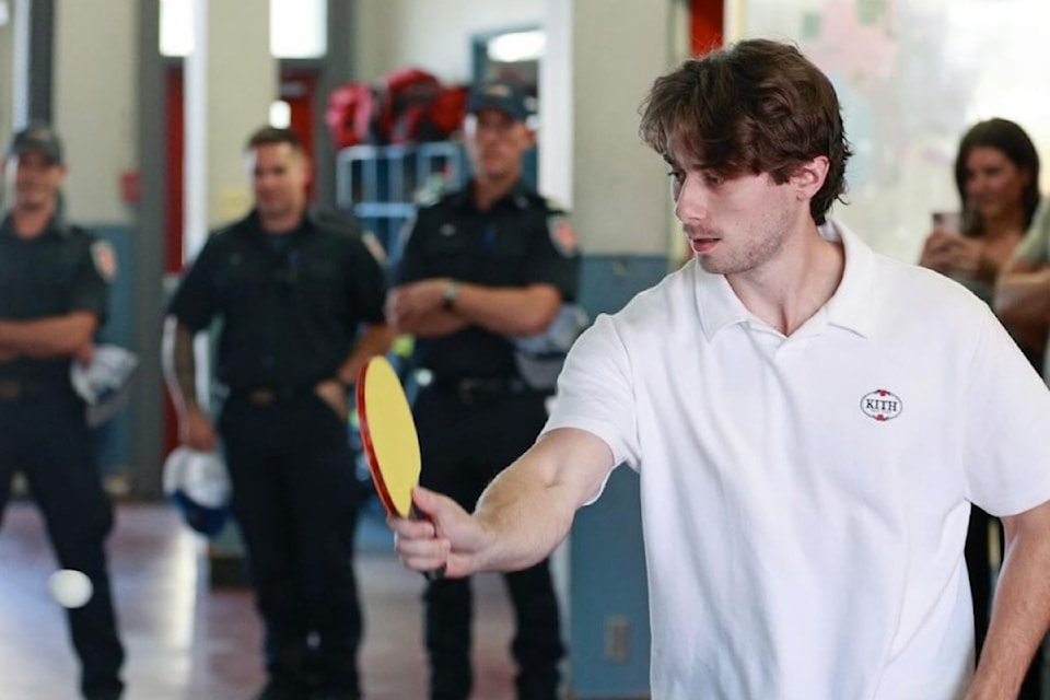 Quinn Hughes playing table tennis at the Penticton Fire Department on Thursday, Sept. 19.