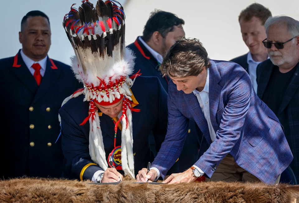 29331372_web1_220602-CPW-Trudeau-settlement-Alberta-First-Nation-Signing_1