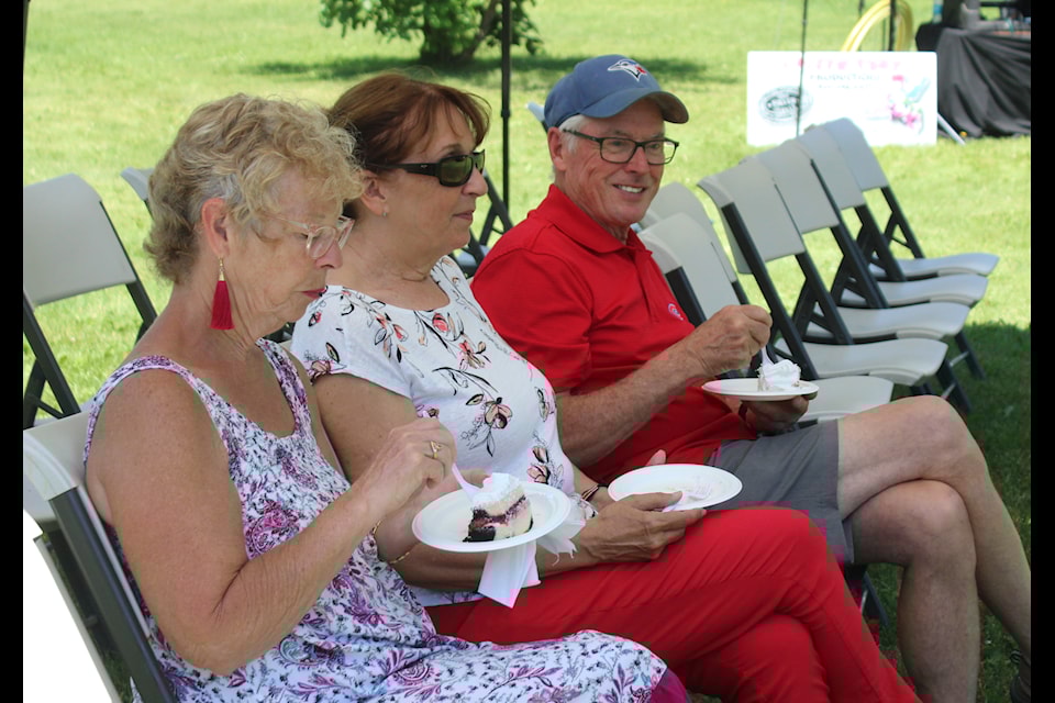 Janet Schreder, Jennifer Thompson, and Eugene Thompson enjoy some Canada Day cake and a bit of shade during the festivities.
(Mark Weber/Rimbey Review)