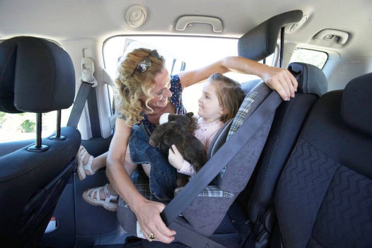 Child in front seat alberta store