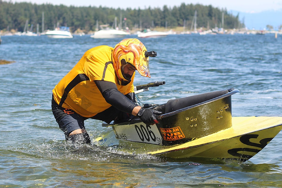 Jaime Garcia climbs out of his tub at the beach at Maffeo Sutton Park at the end of the Great International World Championship Bathtub Race. In which Canadian city did bathtub racing originate? (Greg Sakaki/News Bulletin)