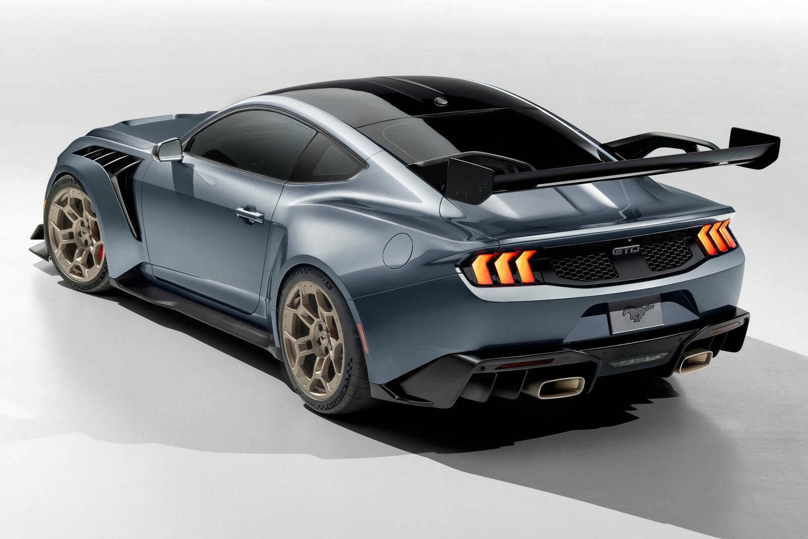 The bulging front and rear fenders, which allow for a 10-cenimetre increase in width between the front wheels and the rears, contain air vents to help cool the engine and large-diameter carbon-ceramic brakes. PHOTO: FORD