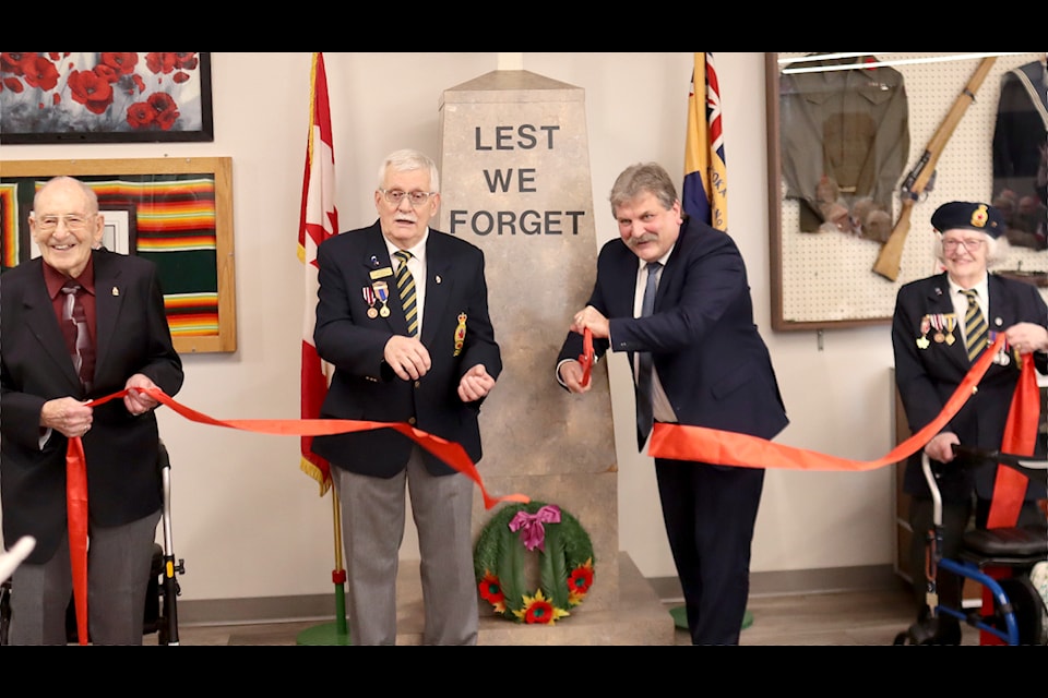 Cutting the ribbon, left to right: 50-year member George Crowhurst, President Earl Peavoy, Mayor Kevin Ferguson and longtime member Rose Stoddart. 