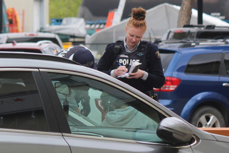 Ponoka RCMP officers respond to an incident on Chipman Avenue Friday, May 31. (Mark Weber/Ponoka News)