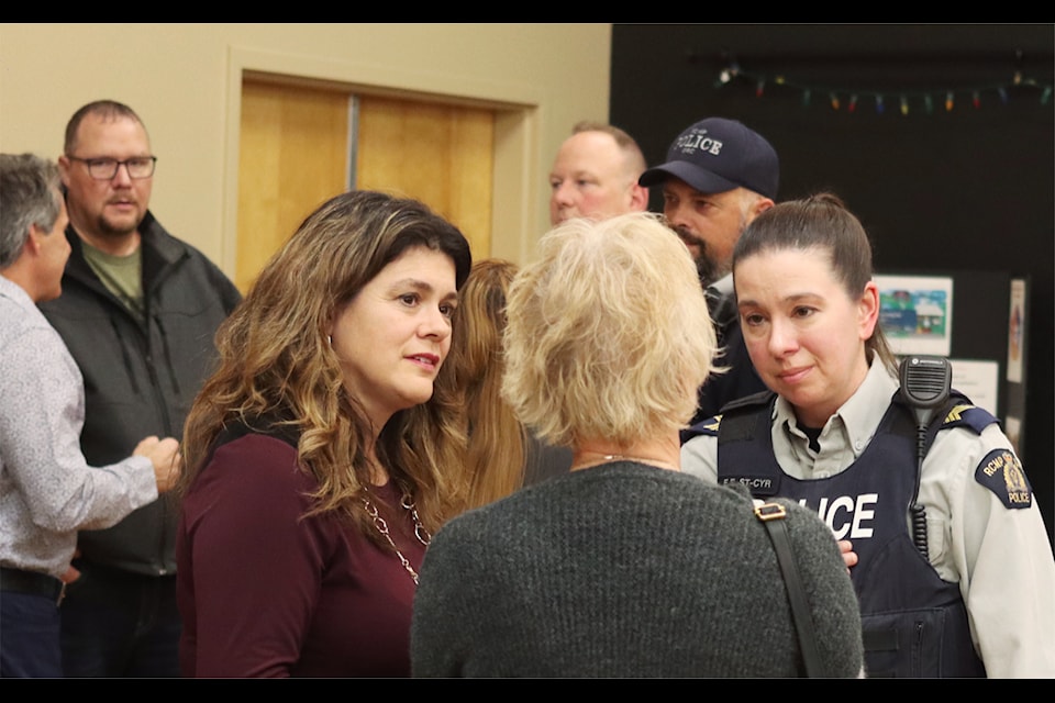 MLA Jennifer Johnson, left, and Ponoka detachment commander Staff Sgt. Erin St-Cyr speak to people at the public engagement session at the Ponoka Drop-in Centre on Oct. 24. 