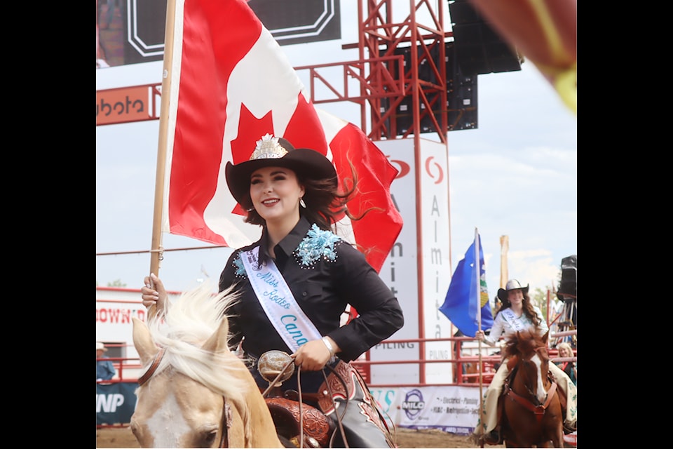 Miss Rodeo Canada Codi Wilson rides in, followed by Miss Ponoka Stampede Kyla Lightfoot.