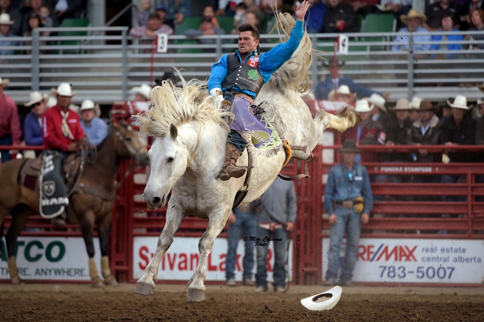 Bareback rider Caleb Bennet makes a tough ride on C5’s Virgil during Ponoka Stampede 2016. Virgil is this year’s face of Ponoka Stampede’s collector’s edition poster. 
