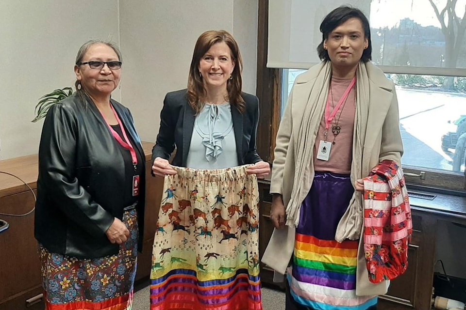 Elder Lavenia Schug, left,  and Chevi Rabbit, right, met with Minister Tanya Fir to create Walk a Mile in a Ribbon Skirt Day. 