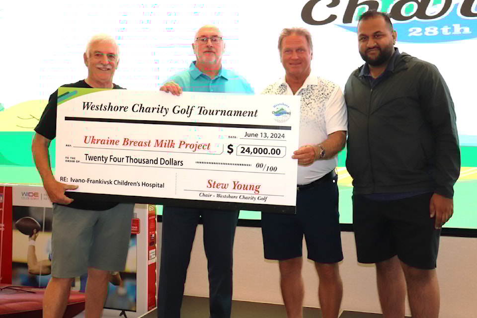 Bruce Brown, Bob Beckett, Stew Young and Ravi Parmar present a cheque for a Ukraine project at the Westshore Golf Tournament.