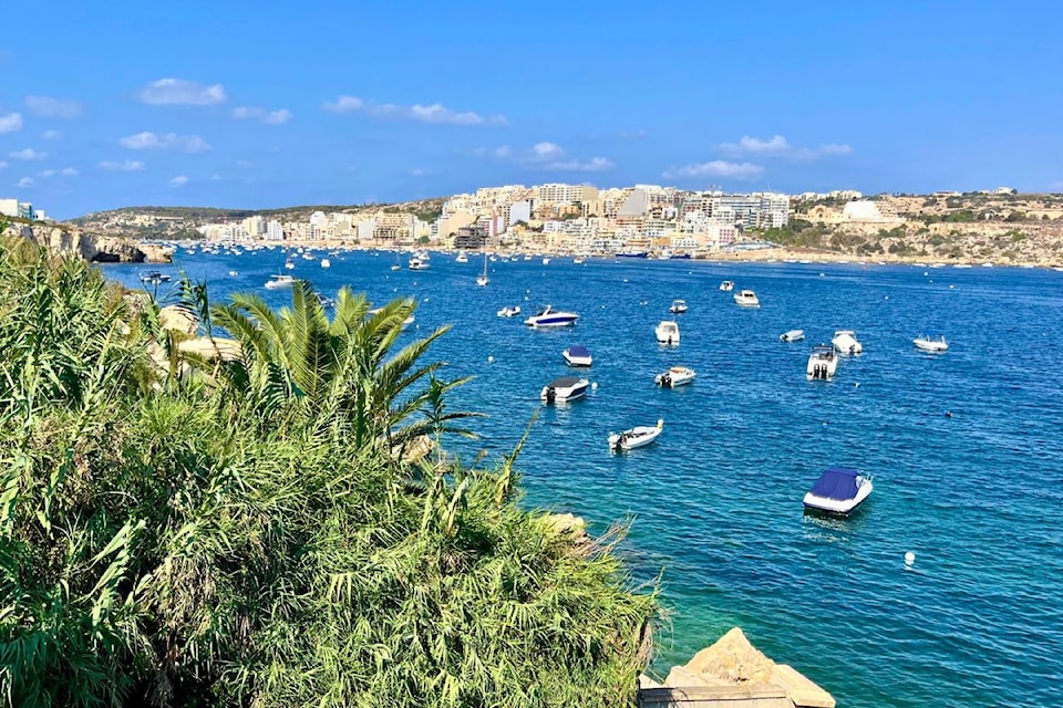 The shoreline view of Malta is one of bright blue waters and limestone cliffs.