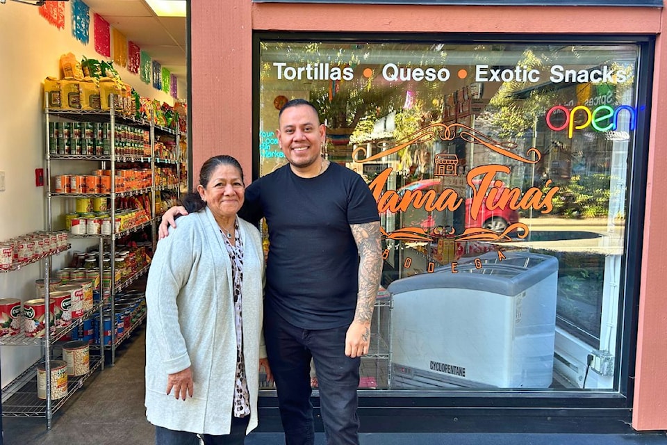 Carlos Lopez and his mother, Mama Tina, who he named his store in Langford after.
