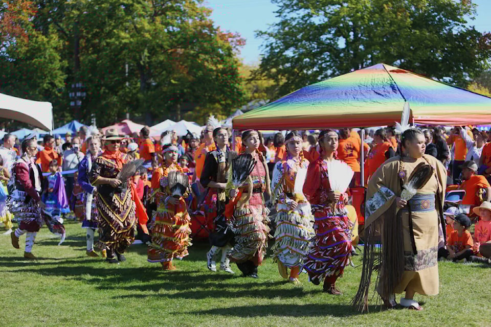 Dancers in regalia participate in a Grand Entry during the South Island Powwow at Royal Athletic Park in Victoria. 