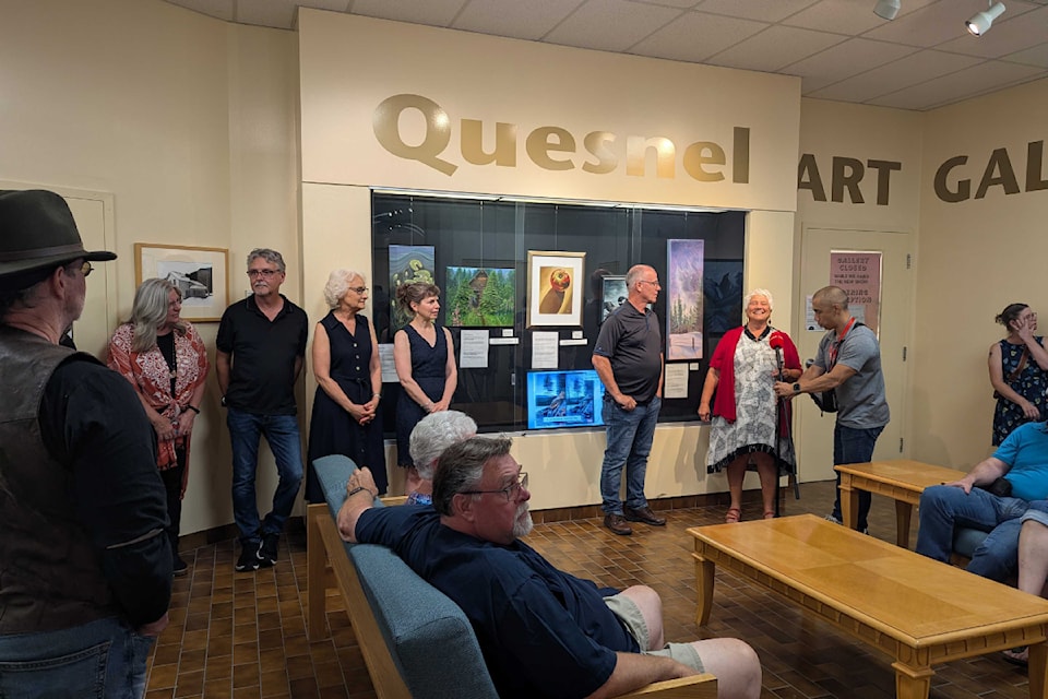 The five artists presented in front of their work at the front before the exhibit was opened.
