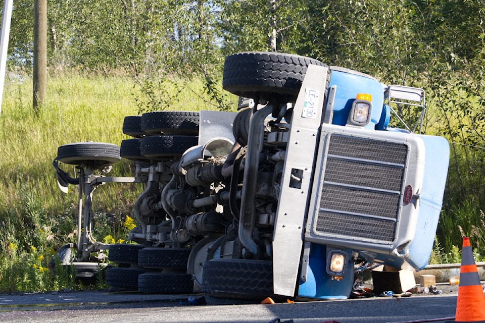 The turn signal was still blinking as the truck was left on its side.