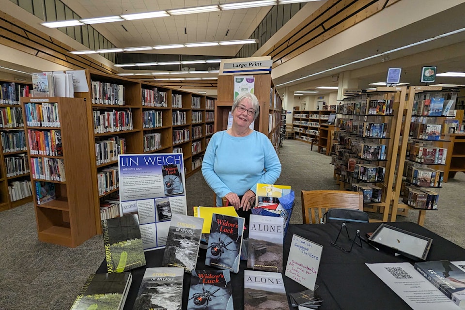 Lin Weich at her table where she shared her work during the event.