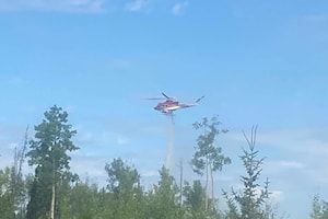 Snaking River wildfire still being held, showers and risk of thunderstorm on the way