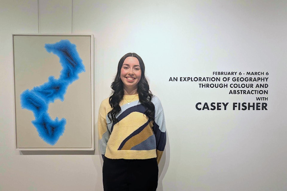 Casey Fisher opened her first solo exhibit at the Quesnel Art Gallery Thursday (Feb. 6). It is a culmination of work she has created while attending Emily Carr University. The piece to her left is Quesnel's Dragon Lake.
