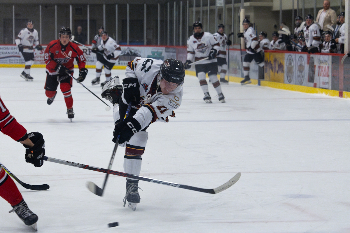 Toren Fron takes a big shot at Chase's net.