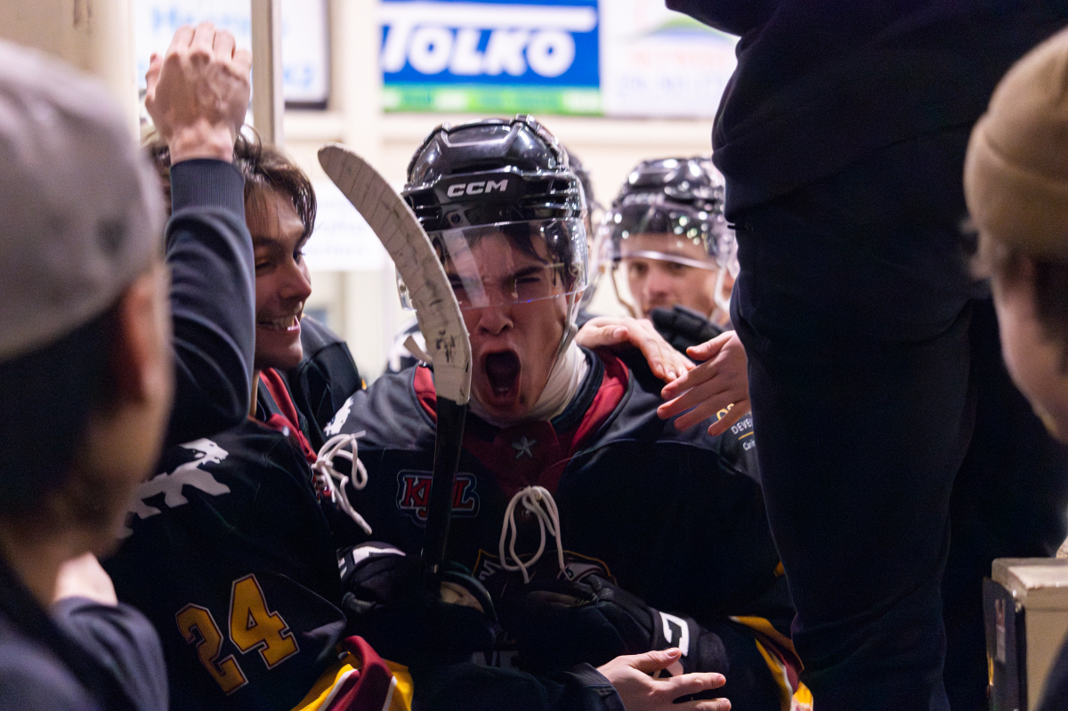 Isaiah Bagri lets out a shout of joy as he comes off the ice, surrounded by fellow River Rush players