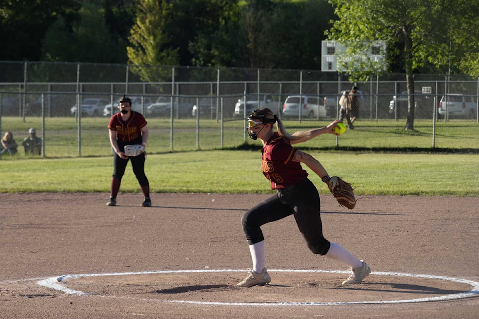 A pitcher winds up to throw the ball.