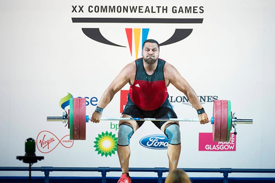 13003381_web1_copy_180808-QCO-weightlifter1