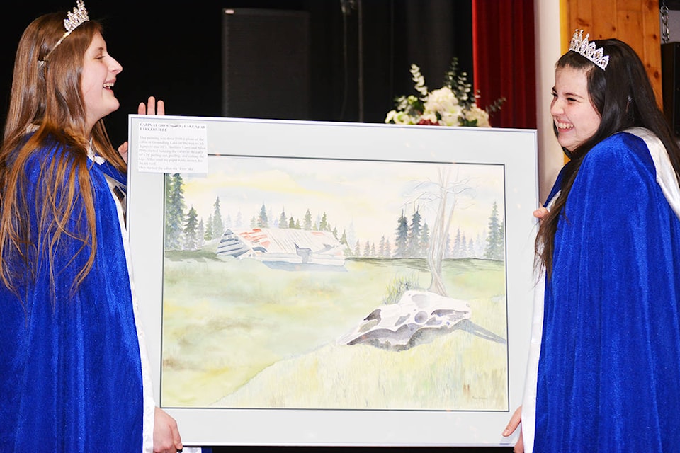Quesnel Princesses Sierra Moore (left) and Gracie Combs display one of the auction items during the 18th annual Hearts for Hospice event Feb. 9 at the Quesnel and District Seniors’ Centre. This year’s event raised $40,000. See story on page B12 for more. Lindsay Chung photo