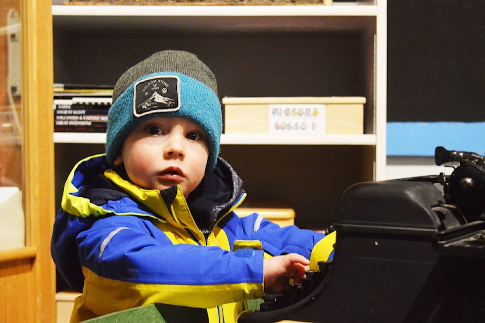 Alden Chatwin, 2, was transfixed by an old typewriter at the Quesnel Museum and Archives on Saturday afternoon. Ronan O’Doherty photos
