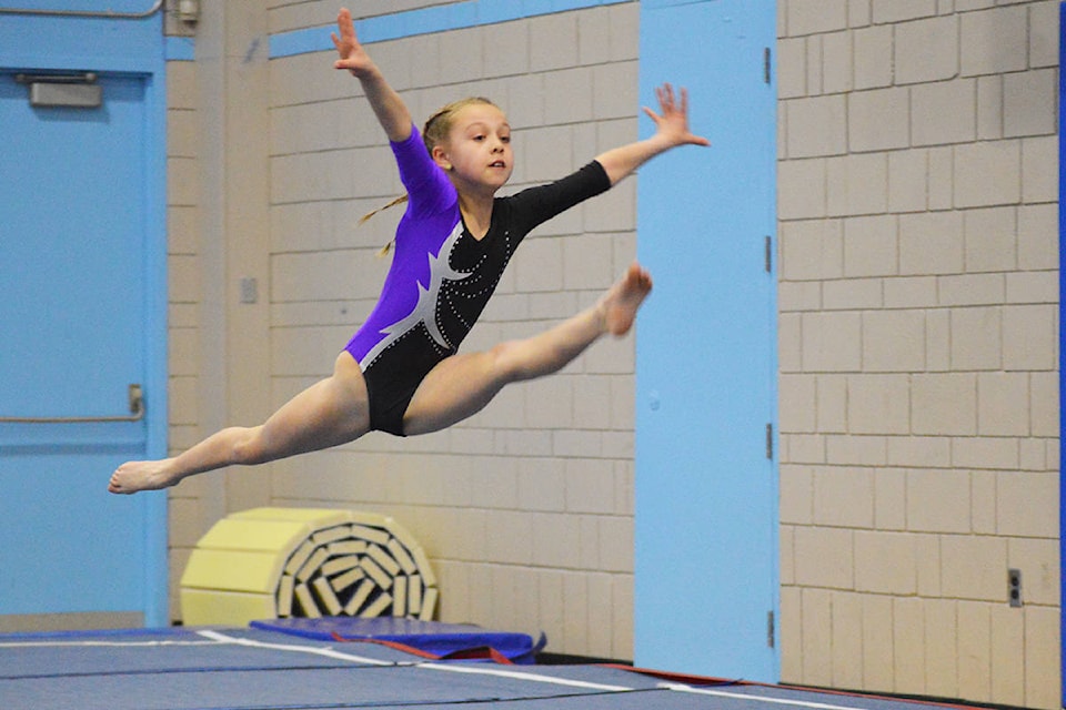 Sienna Glymchuk soars through the air during her floor routine at Quesnel Technics Gymnastics Club’s annual Gold Pan meet Ronan O’Doherty photos