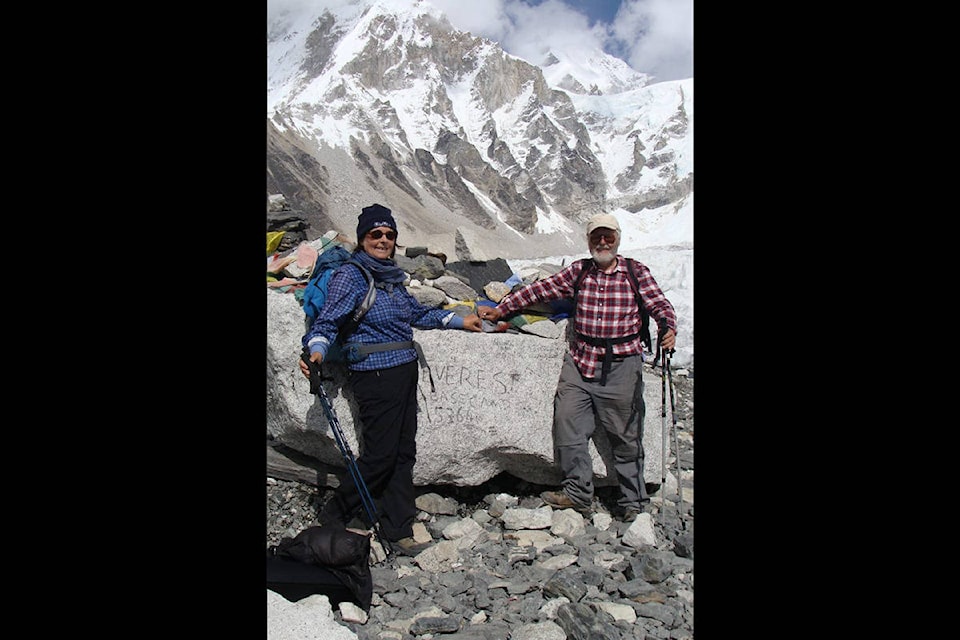 Above, Wolfgang Hofmeier, right, and his sister Irmgald at the Everest Base Camp in Nepal. At right, Hofmeier smiles for a photo with the peak of Mount Everest in the background. Wolfgang Hofmeier/Facebook photos