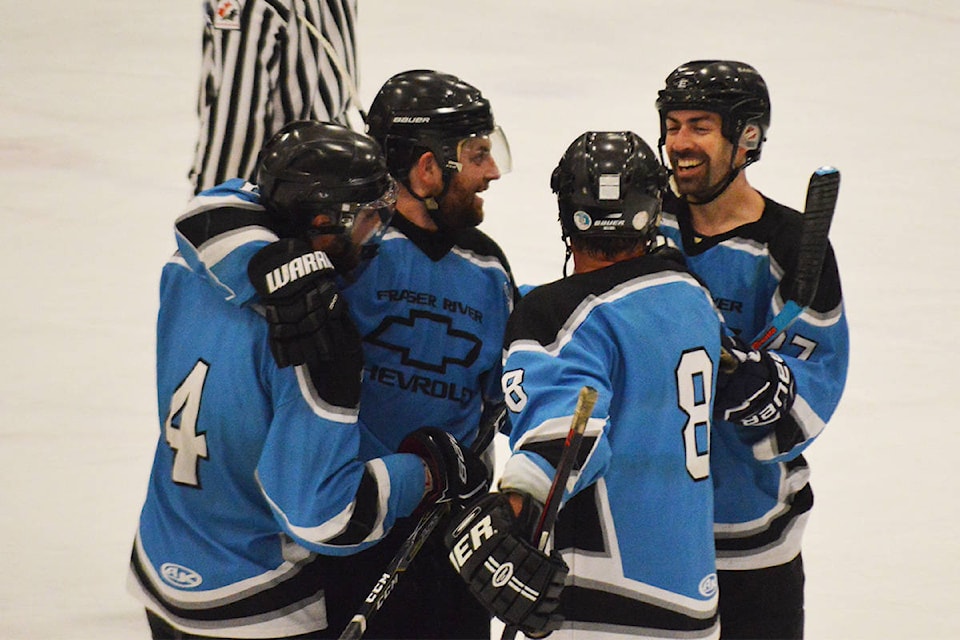 Hugs all around for the victorious Fraser River side.