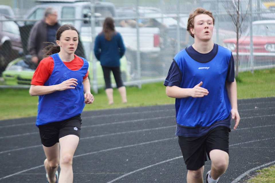 Ruby Nicholas and Josh Tilsner keep a steady pace in the 1500m race.