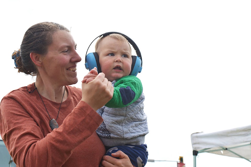 Lacey Hamelin and her son Mathéo, who is almost one, dance to the music of local band Roadblock during the Quesnel Farmers’ Market May 18. Lindsay Chung photo