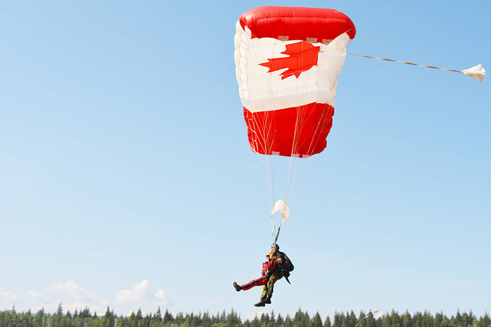 Barb van Halderen from the SkyFest board of directors comes in for a landing during her tandem jump with the SkyHawks Sunday morning. Lindsay Chung photo