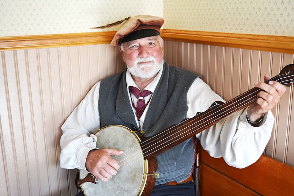 Patrick Haas from Tacoma, Wash., plays music to welcome visitors to the Cascadiens’ display Sunday (Aug. 11) at Barkerville Historic Town and Park. Lindsay Chung photos