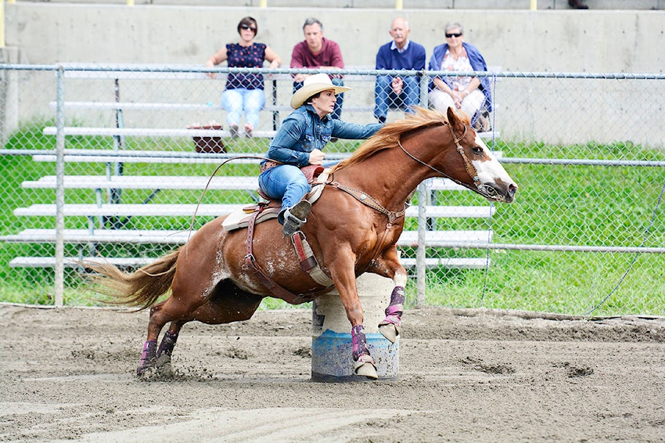 Jody Gilson competes in the open category at the British Columbia Barrel Racers Association Finals at Alex Fraser Park. For more photos and a story, please see pages A9 and B11. Karen Powell photo