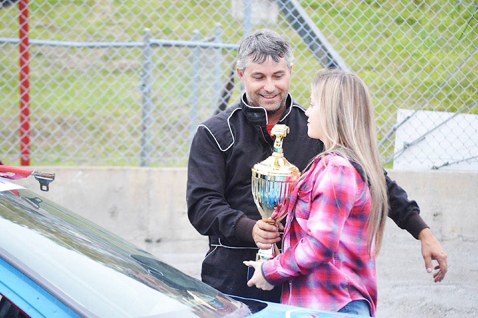 Quesnel’s Dustin Brown accepts a trophy for his performance in the mini-stock races at the Gold Pan Speedway Saturday (Sept. 21) Ronan O’Doherty photos Quesnel’s Dustin Brown accepts a trophy for his performance in the mini-stock races at the Gold Pan Speedway Saturday (Sept. 21) . Ronan O’Doherty photos