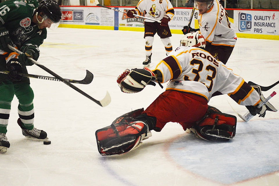 Roos goalie Brandon Peacock stretches to make a save against a hovering Kaleb Boyle Saturday, Nov. 16 at the West Fraser Centre. Ronan O’Doherty photos.