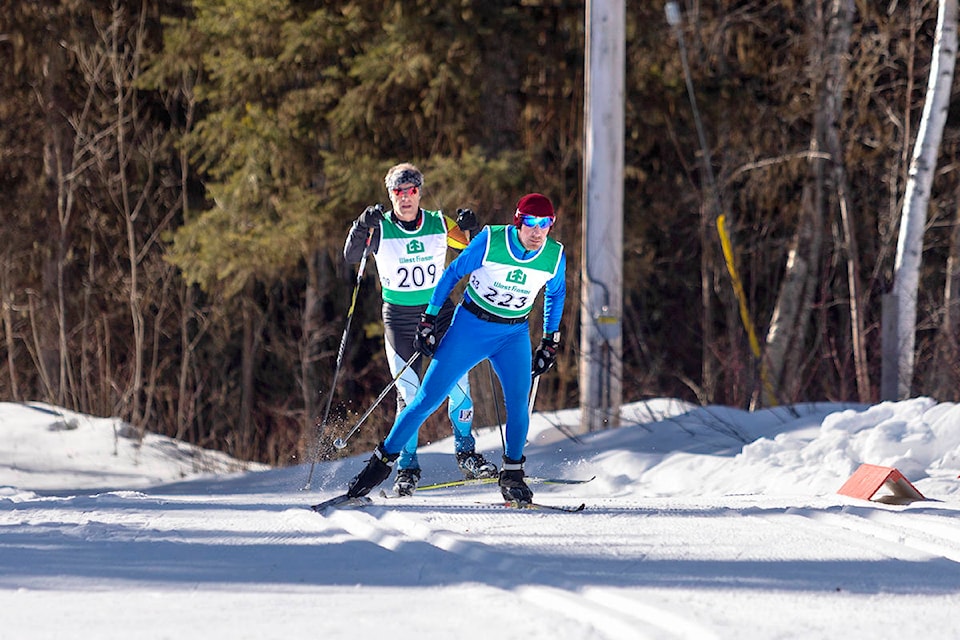 Cross country skiers Kevin Sturt (223) and Chris Elden (209) compete in the 24-kilometre race during the second annual Cariboo Fun Freestyle Race at Hallis Lake on March 8. (Sasha Sefter - Quesnel Cariboo Observer)