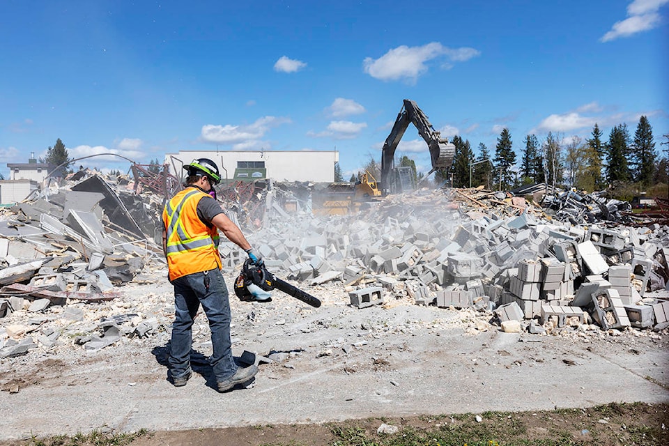 Construction crews working on the the demolition of the old Quesnel Junior School building on May 7. (Sasha Sefter - Quesnel Cariboo Observer)