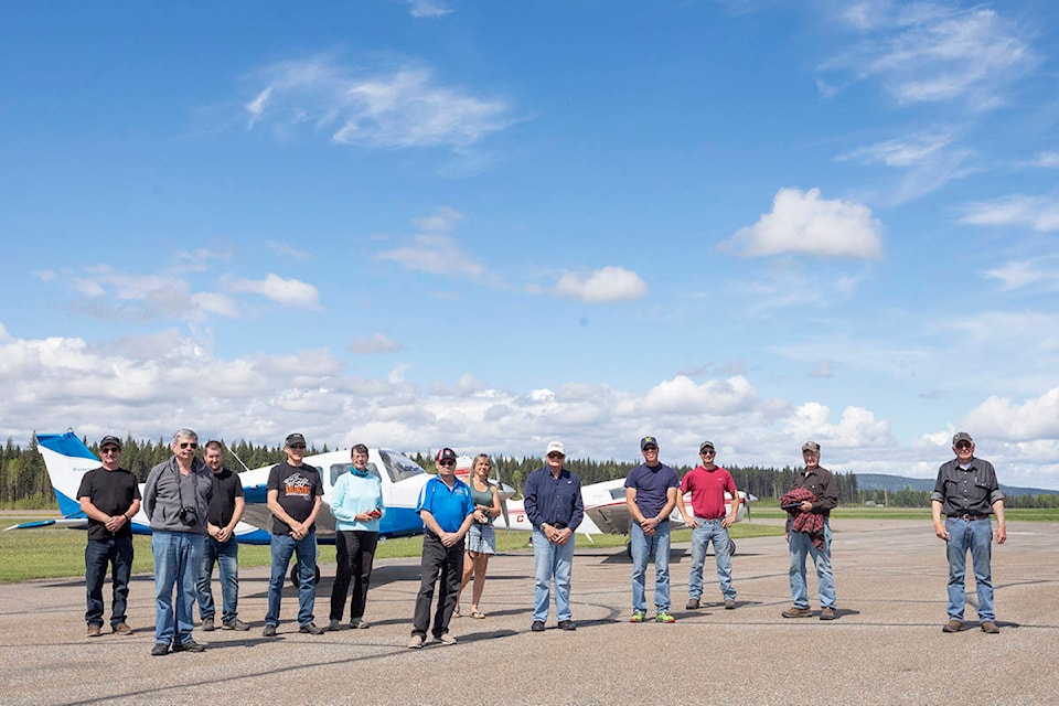 Members of the Quesnel Flying Club pose for a photo after taking part in a tribute flight to fallen Snowbirds’ Captain Jennifer Casey on May 23. (Sasha Sefter - Quesnel Cariboo Observer)
