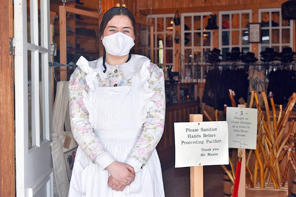 Loraine Brisebois, sales clerk at Mason & Daly General Merchants at Barkerville Historic Town & Park welcomes visitors on the weekend. This is the second season at Barkerville for Brisebois who is from Quesnel. Barkerville is limiting the site to 200 visitors per day during the COVID-19 pandemic, and is encouraging visitors to wear masks.(Rebecca Dyok photo)