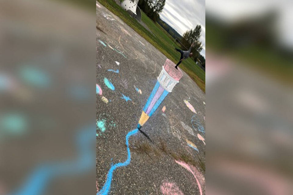 Artist Scott Gillies created this 3D chalk art at Ecole Red Bluff Lhtako Elementary last week. (Photo submitted)