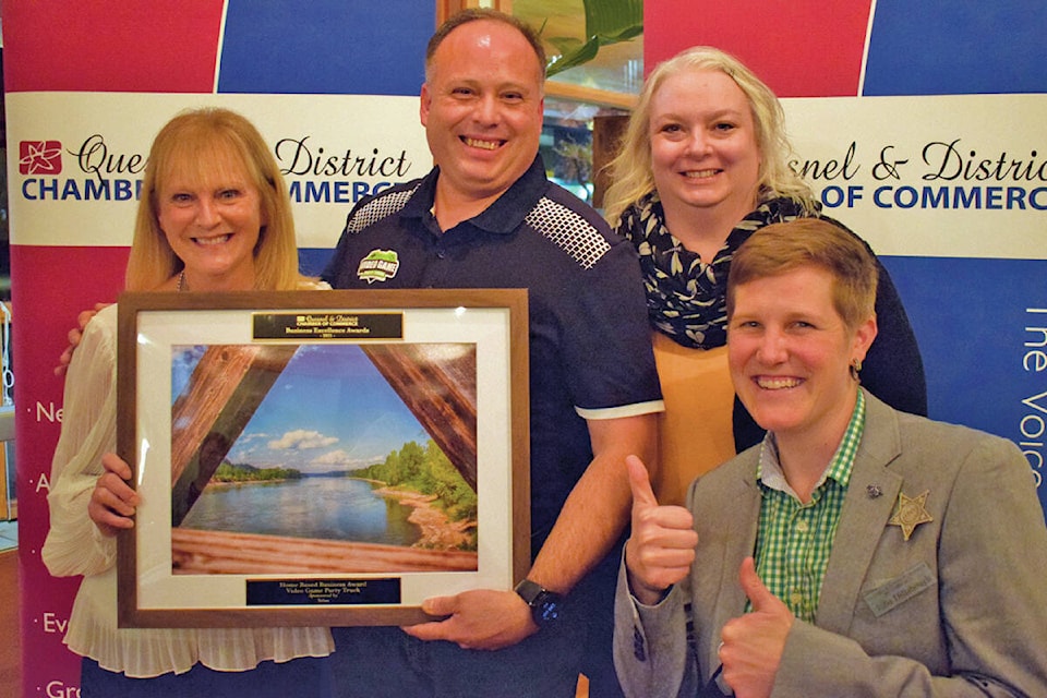 Carlos Gonzalez accepts the Home Based Business award alongside chamber manager Kathy Somerville (far left), chamber director Lisa Foottit and Julia Dillabough from Telus, who sponsored the award. Gonzalez runs the Video Game Party Truck. (Tracey Roberts Photo - Quesnel Cariboo Observer)