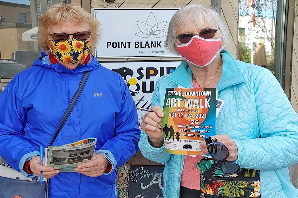 Art walkers Bonny Carr and Janet Reinsdorf enjoyed a sunny afternoon in downtown Quesnel on Saturday, Oct. 23 exploring the work of local artists displayed at 26 businesses. (Rebecca Dyok photo)