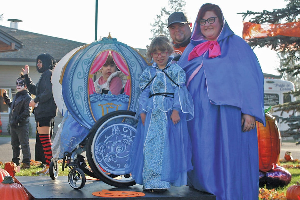 Jody, Lucy and Lily Gallant teamed up for a Cinderella-themed costume for Halloween, complete with magic carriage. The trio were one of dozens of families who took part in the parade of costumes in front of Dunrovin Park Lodge. (Cassidy Dankochik Photo - Quesnel Cariboo Observer)
